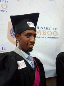 Hailu Dagnachew pictured at his graduation, wearing a cap and gown