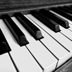 A black and white photo of piano keys