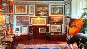 A room filled with paintings of wild animals